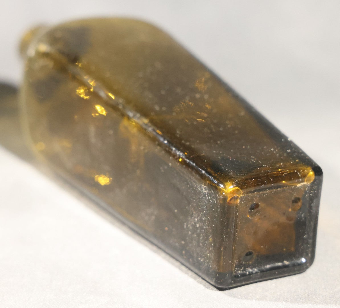 Grouping of Five Antique Case Bottles, Olive Green and Amber Glass, Tapered Square Form, Possible Gin Bottles, 19th Century & 20th century
