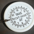 Lot 028 - Antique Acme Tumbler Cover and Dose Indicator with "Take Next Dose At" Clock Face Reminder, Sharon Manufacturing Company, Philadelphia, Pennsylvania, Patent 1896, 4" W