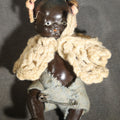 Lot 046 - Vintage Miniature Composition Black Baby Doll with Crocheted Shawl and Fabric Diaper, 3-3/4" H