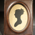 Lot 050 - Antique Silhouette Portrait Bust Profile of a Woman in Oval Wood Frame, 4-5/8" W x 5-7/8" H