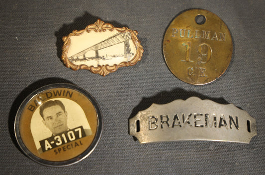 Grouping of four Vintage Railway Employee Badges and Tags including Walkway Over the Hudson Cantilever Bridge Pin, Pullman 19 C.E. Brass Tag, Baldwin A-3107 Special Photo emplopye ID badge, and Brakeman Metal Badge