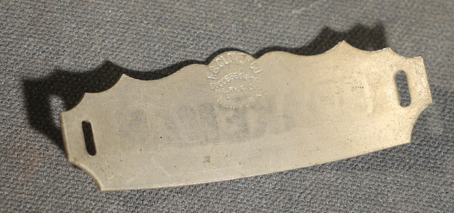 Grouping of four Vintage Railway Employee Badges and Tags including Walkway Over the Hudson Cantilever Bridge Pin, Pullman 19 C.E. Brass Tag, Baldwin A-3107 Special Photo emplopye ID badge, and Brakeman Metal Badge