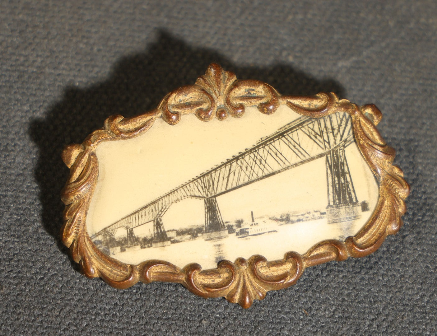 Grouping of four Vintage Railway Employee Badges and Tags including Walkway Over the Hudson Cantilever Bridge Pin, Pullman 19 C.E. Brass Tag, Baldwin A-3107 Special Photo emplopye ID badge, and Brakeman Metal Badge