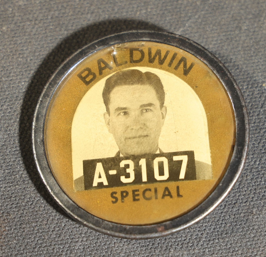 Grouping of four Vintage Railway Employee Badges and Tags including Walkway Over the Hudson Cantilever Bridge Pin, Pullman 19 C.E. Brass Tag, Baldwin A-3107 Special Photo emplopye ID badge, and Brakeman Metal Badge