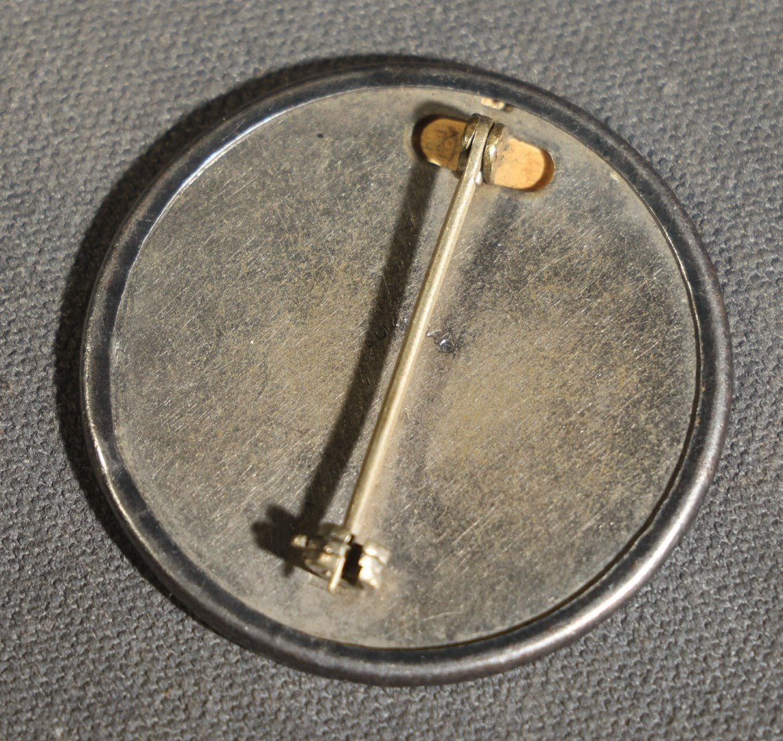 Grouping of four Vintage Railway Employee Badges and Tags including Walkway Over the Hudson Cantilever Bridge Pin, Pullman 19 C.E. Brass Tag, Baldwin A-3107 Special Photo emplopye ID badge, and Brakeman Metal Badge