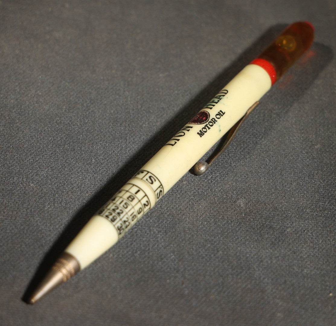 Pair of Vintage Advertising Items, Rheingold Beer Foam Scraper and Lion Head Motor Oil Pencil with real oil sample