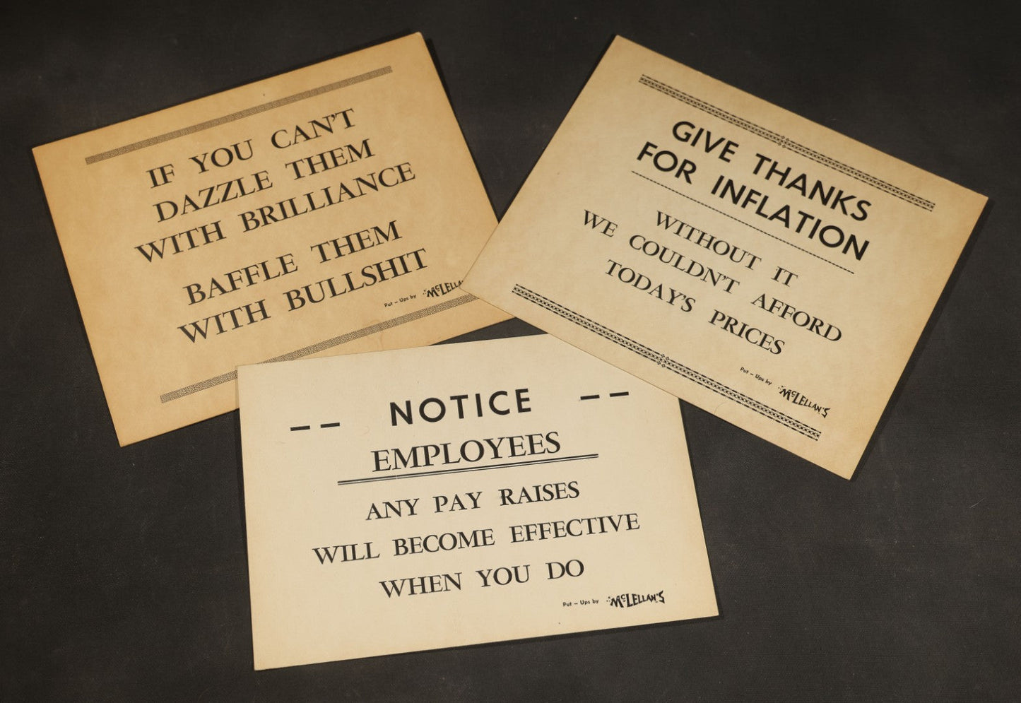 Trio of Vintage Humorous Office Signs including "Dazzle Them with Brilliance", "Give Thanks for Inflation", and "Notice Employees", Put-Ups by McLellan's