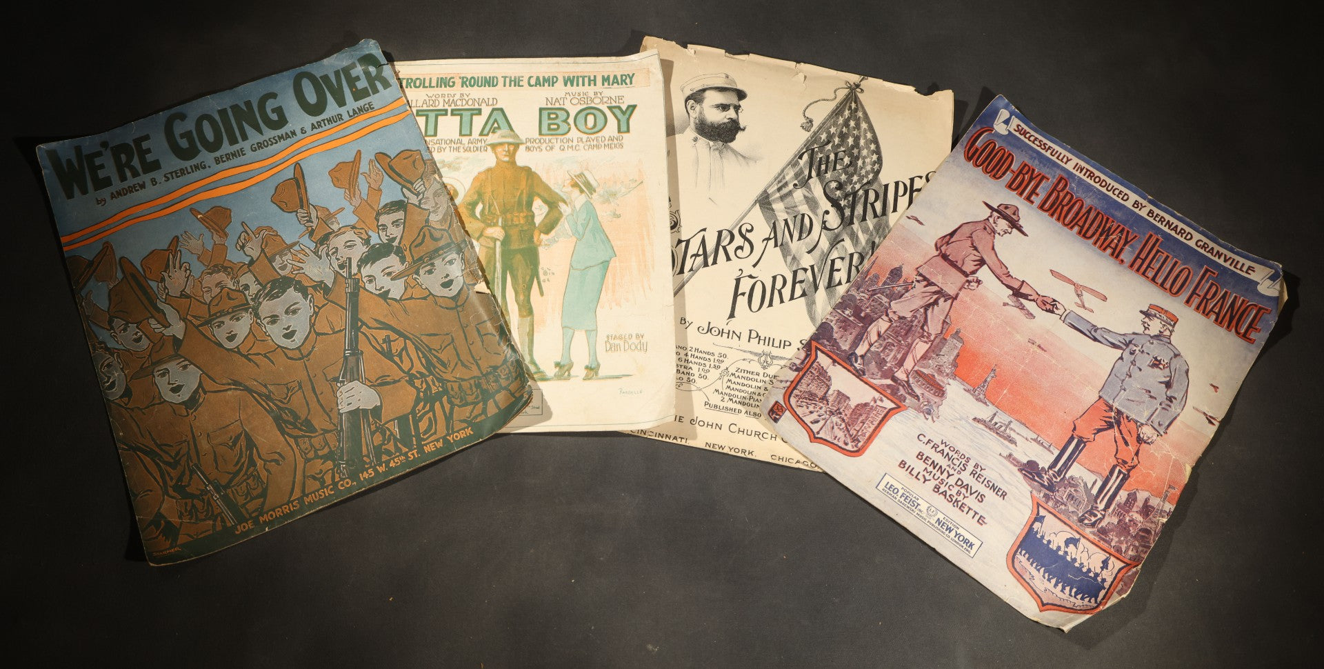 Grouping of four Antique Sheet Music including "We're Going Over," "Good-Bye Broadway, Hello France," "Strolling 'Round the Camp with Mary / Atta Boy," and "The Stars and Stripes Forever!" by John Philip Sousa