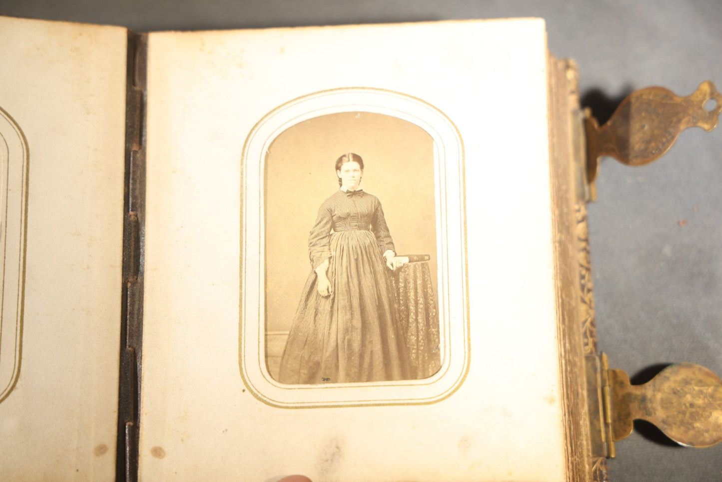Antique Portrait Photo Album Containing 32 Tintype Photographs and 11 Carte de Visite C.D.V. Photographs, Leather Binding with Gauffered Edges, manufactured by Altemus & Co., Philadelphia, circa 1860s