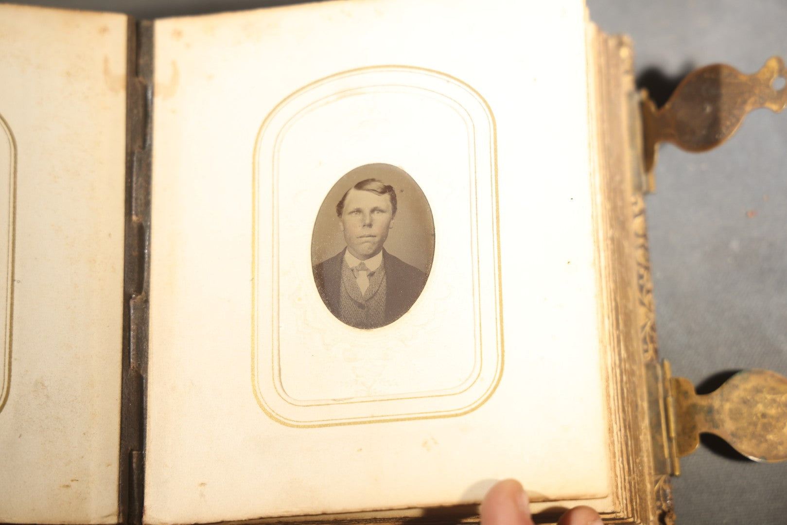 Antique Portrait Photo Album Containing 32 Tintype Photographs and 11 Carte de Visite C.D.V. Photographs, Leather Binding with Gauffered Edges, manufactured by Altemus & Co., Philadelphia, circa 1860s