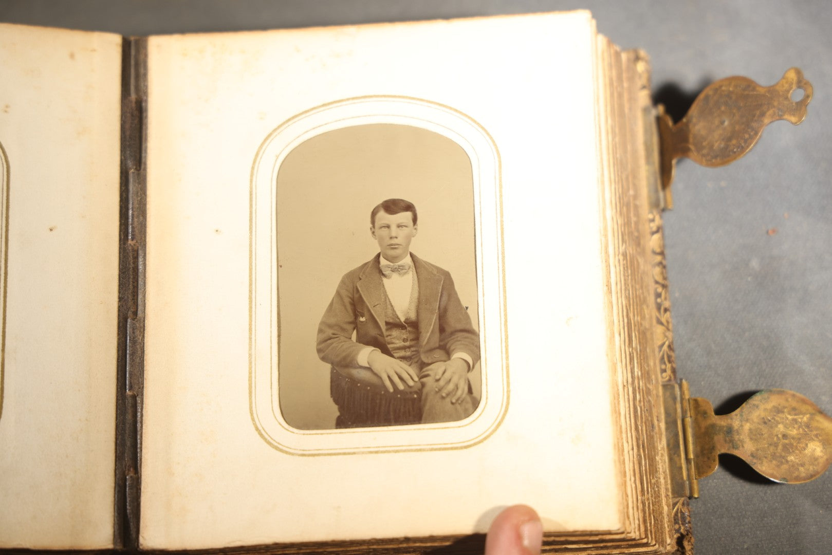 Antique Portrait Photo Album Containing 32 Tintype Photographs and 11 Carte de Visite C.D.V. Photographs, Leather Binding with Gauffered Edges, manufactured by Altemus & Co., Philadelphia, circa 1860s