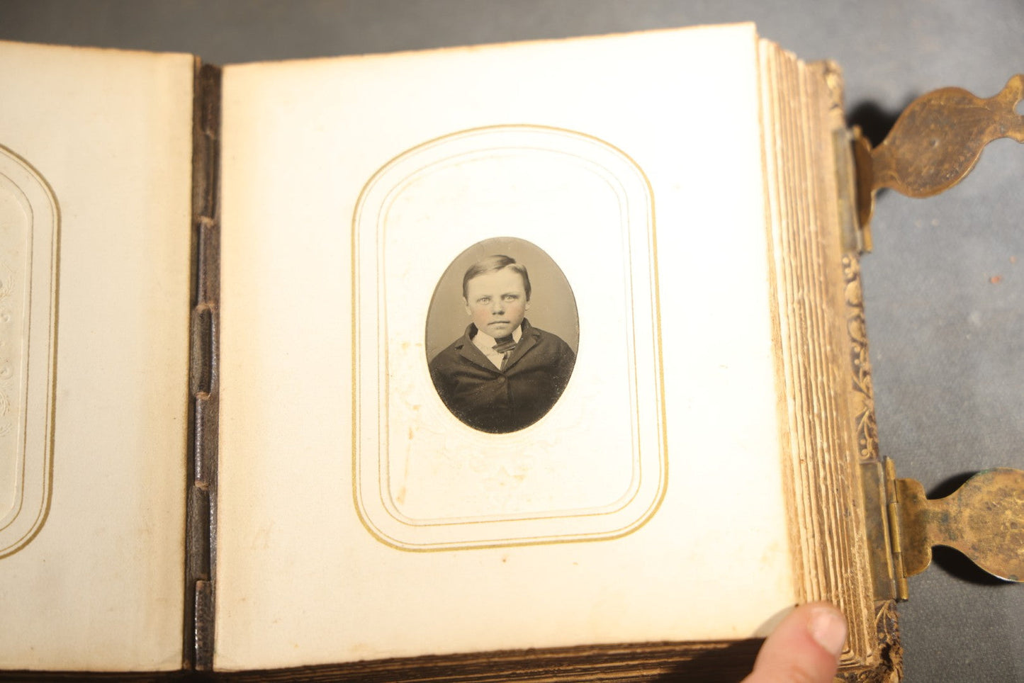 Antique Portrait Photo Album Containing 32 Tintype Photographs and 11 Carte de Visite C.D.V. Photographs, Leather Binding with Gauffered Edges, manufactured by Altemus & Co., Philadelphia, circa 1860s