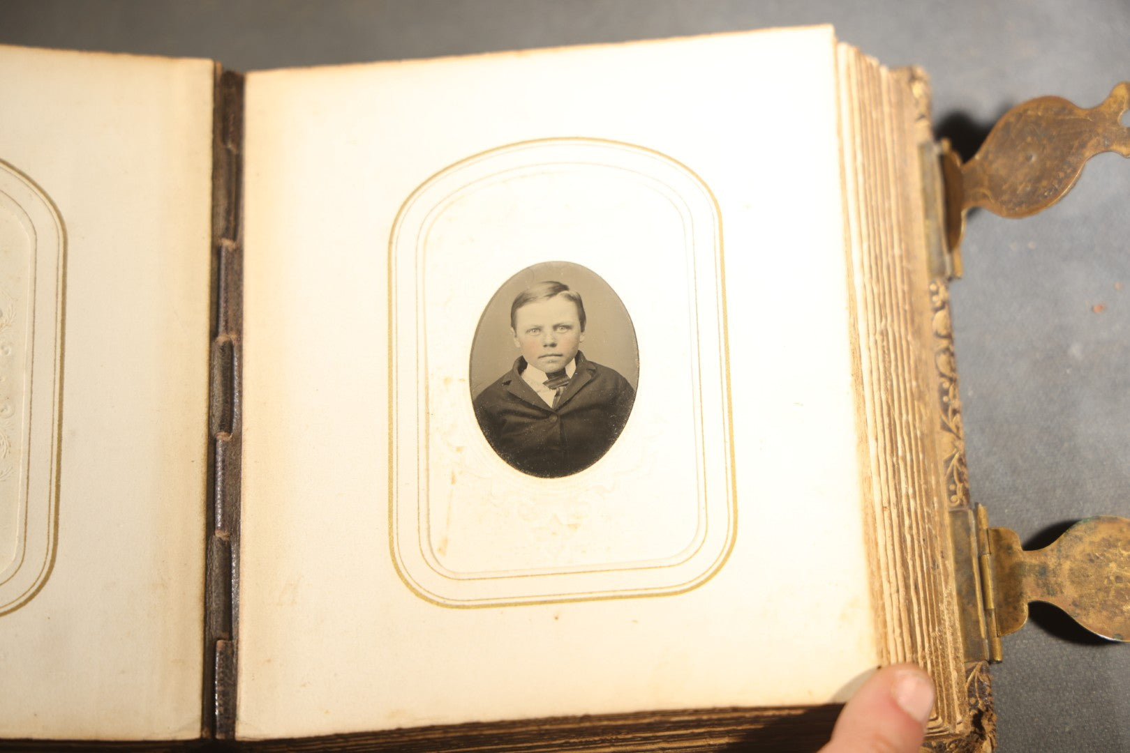Antique Portrait Photo Album Containing 32 Tintype Photographs and 11 Carte de Visite C.D.V. Photographs, Leather Binding with Gauffered Edges, manufactured by Altemus & Co., Philadelphia, circa 1860s