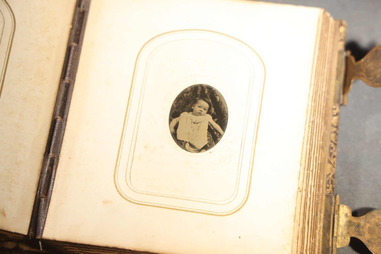 Antique Portrait Photo Album Containing 32 Tintype Photographs and 11 Carte de Visite C.D.V. Photographs, Leather Binding with Gauffered Edges, manufactured by Altemus & Co., Philadelphia, circa 1860s
