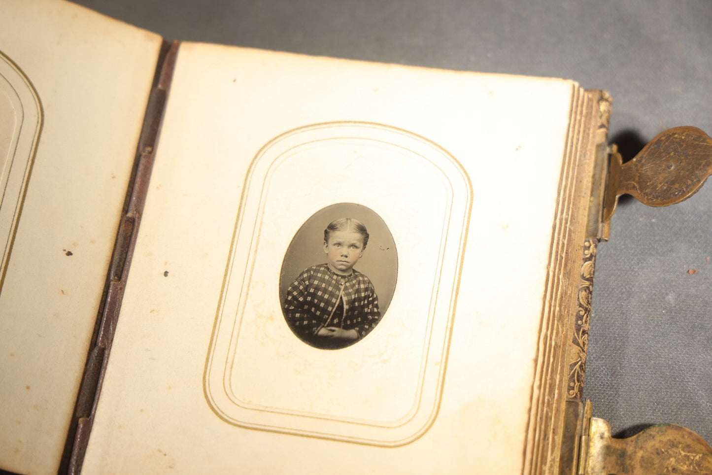 Antique Portrait Photo Album Containing 32 Tintype Photographs and 11 Carte de Visite C.D.V. Photographs, Leather Binding with Gauffered Edges, manufactured by Altemus & Co., Philadelphia, circa 1860s