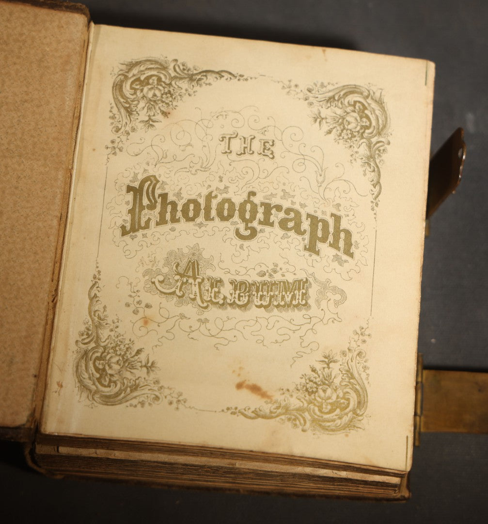 Antique Portrait Photo Album Containing 15 Tintype Photographs and 29 C.D.V. Photographs, Including Hand-Tinted Tintype Examples, note binding in poor condition