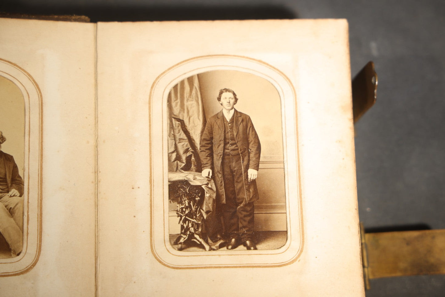 Antique Portrait Photo Album Containing 15 Tintype Photographs and 29 C.D.V. Photographs, Including Hand-Tinted Tintype Examples, note binding in poor condition
