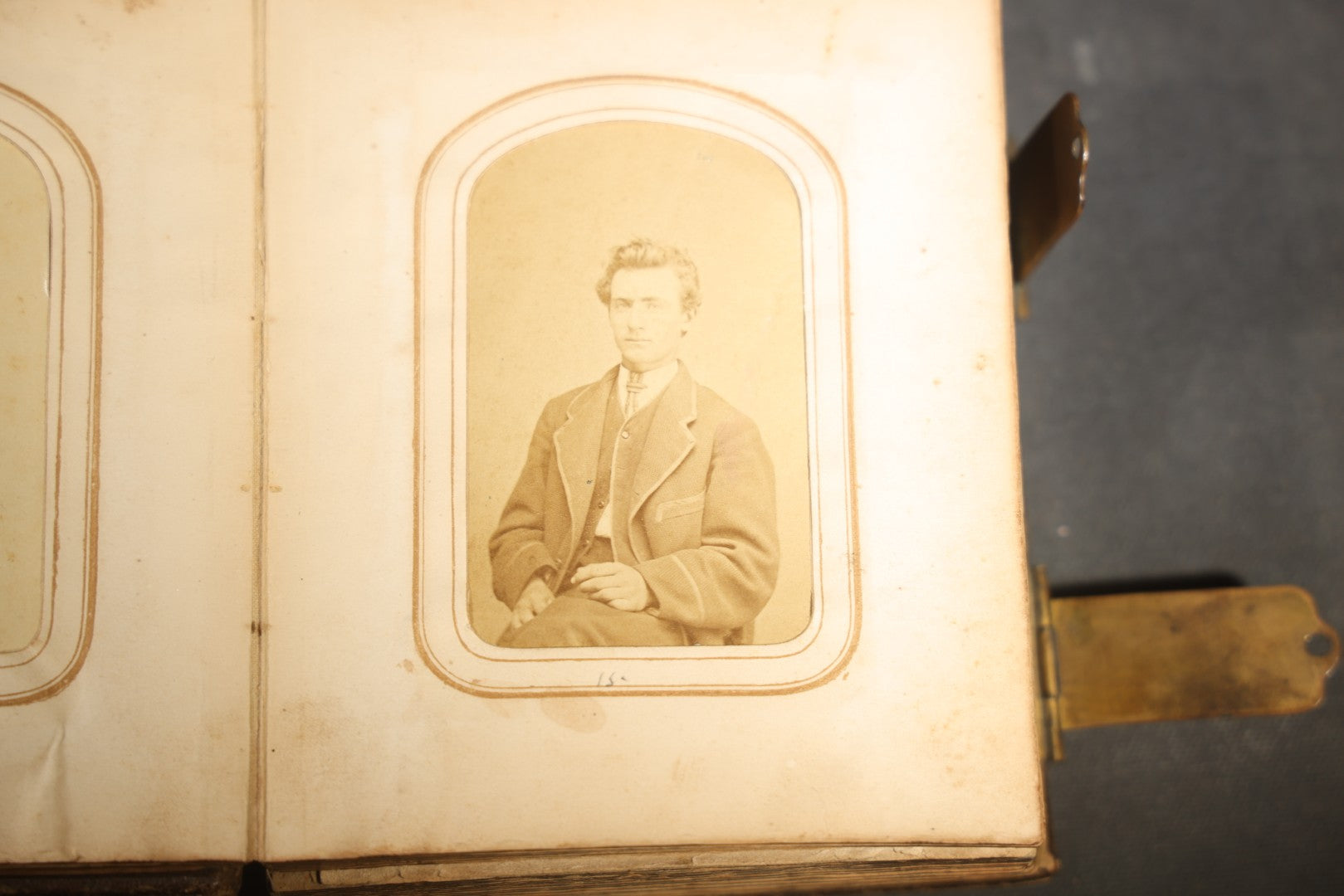 Antique Portrait Photo Album Containing 15 Tintype Photographs and 29 C.D.V. Photographs, Including Hand-Tinted Tintype Examples, note binding in poor condition