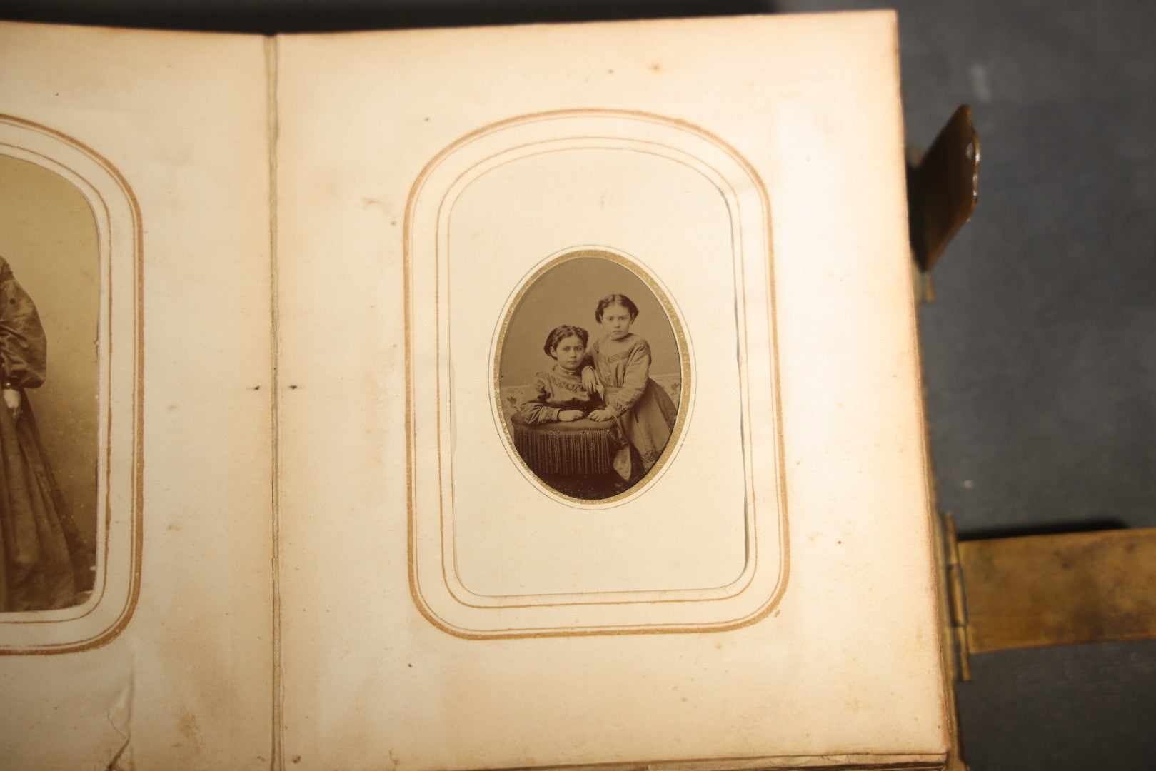 Antique Portrait Photo Album Containing 15 Tintype Photographs and 29 C.D.V. Photographs, Including Hand-Tinted Tintype Examples, note binding in poor condition