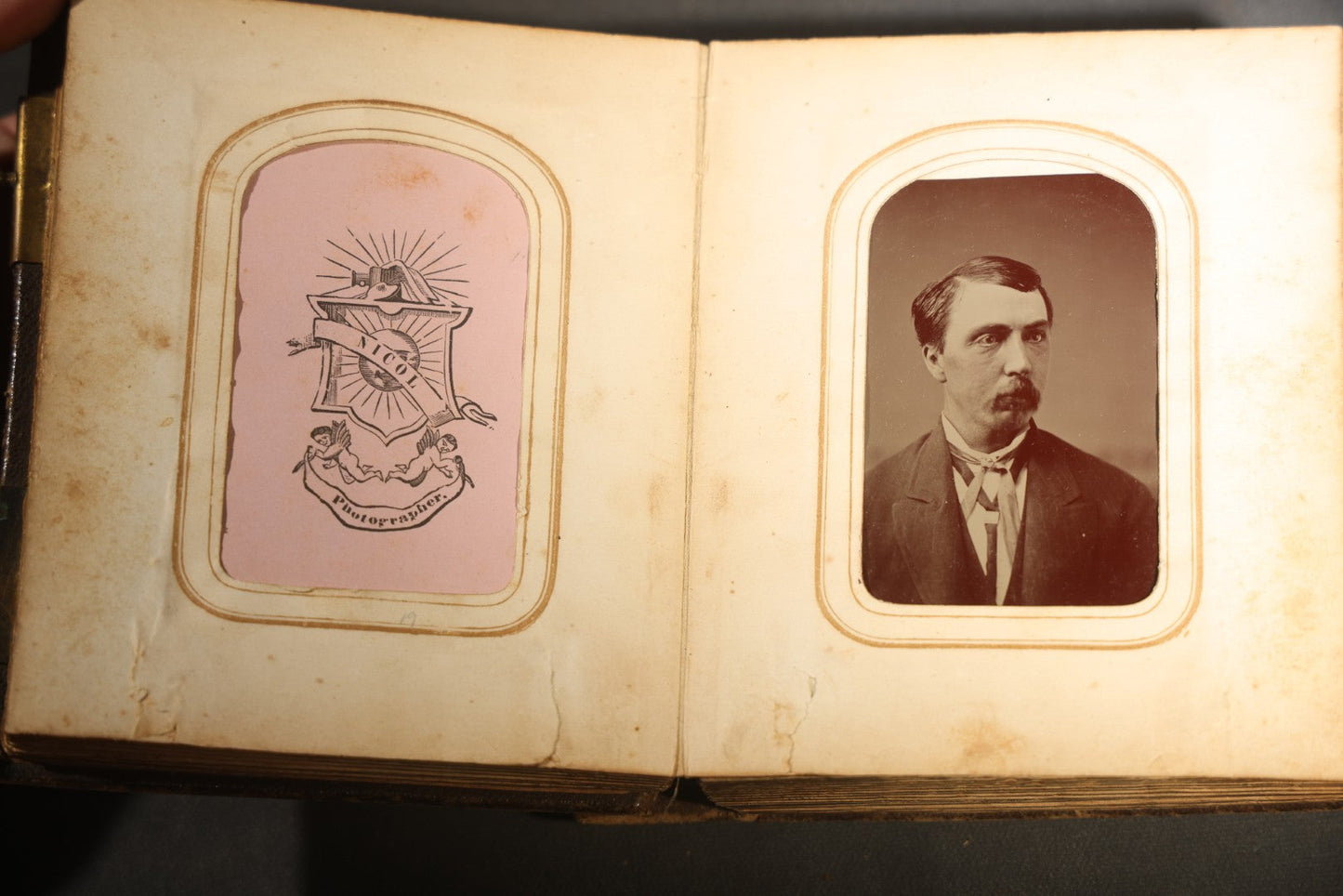 Antique Portrait Photo Album Containing 15 Tintype Photographs and 29 C.D.V. Photographs, Including Hand-Tinted Tintype Examples, note binding in poor condition