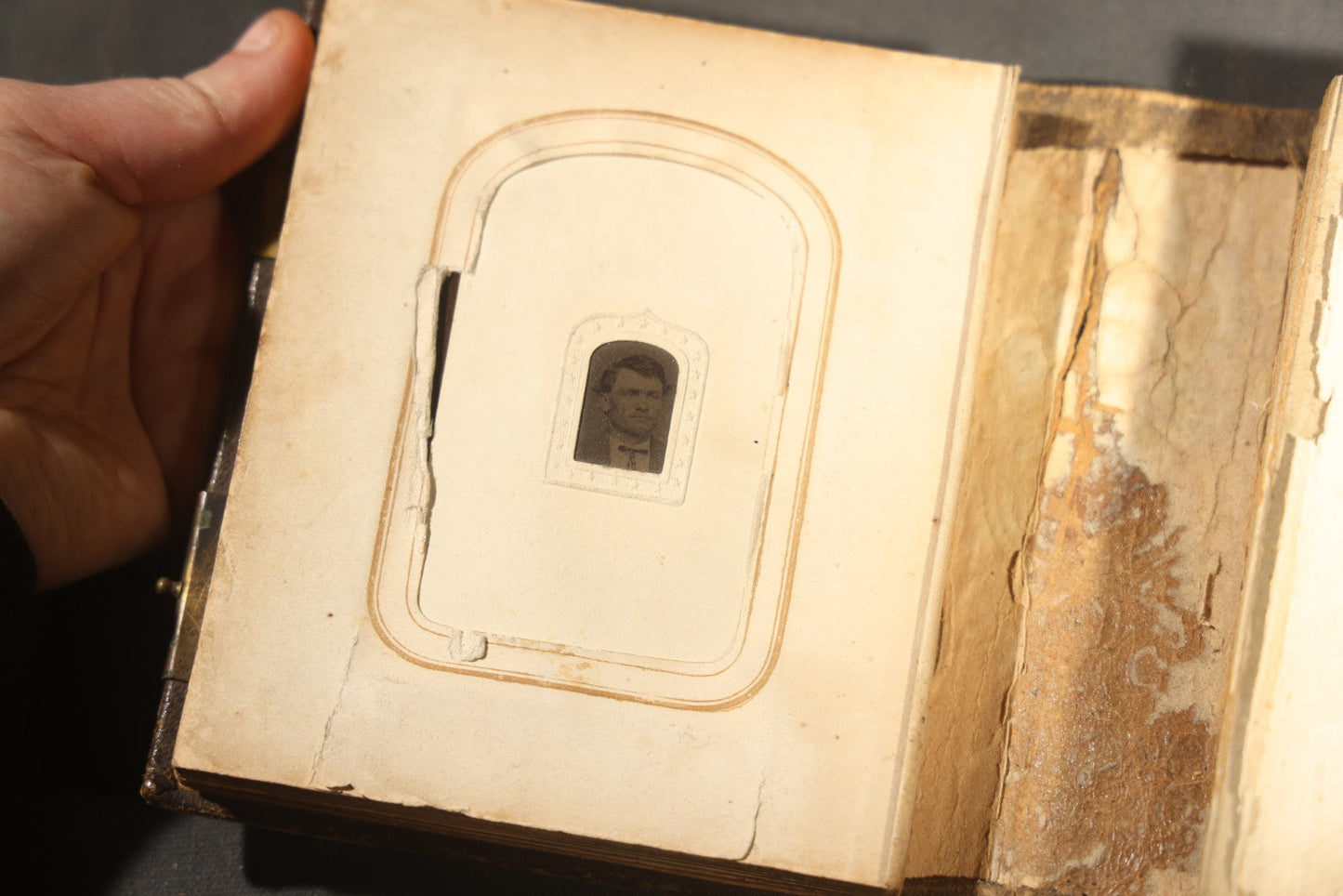 Antique Portrait Photo Album Containing 15 Tintype Photographs and 29 C.D.V. Photographs, Including Hand-Tinted Tintype Examples, note binding in poor condition