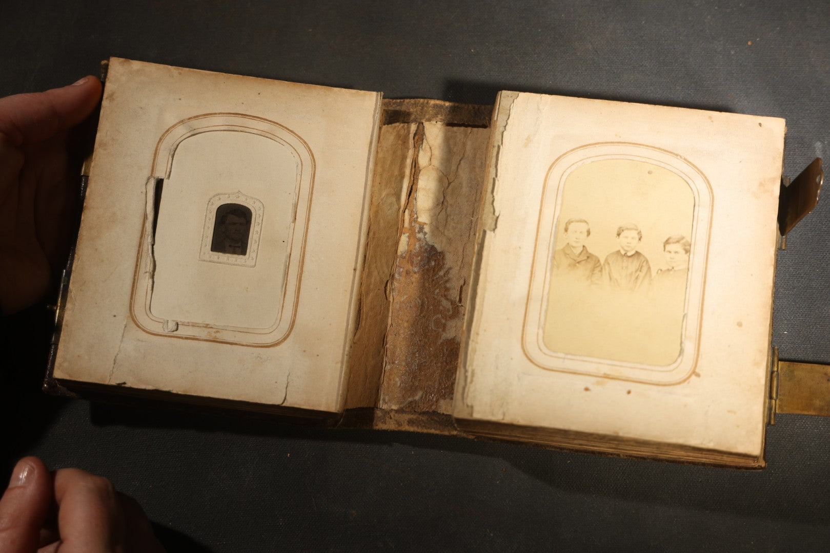 Antique Portrait Photo Album Containing 15 Tintype Photographs and 29 C.D.V. Photographs, Including Hand-Tinted Tintype Examples, note binding in poor condition