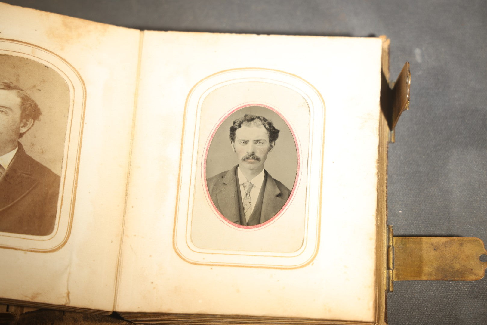 Antique Portrait Photo Album Containing 15 Tintype Photographs and 29 C.D.V. Photographs, Including Hand-Tinted Tintype Examples, note binding in poor condition
