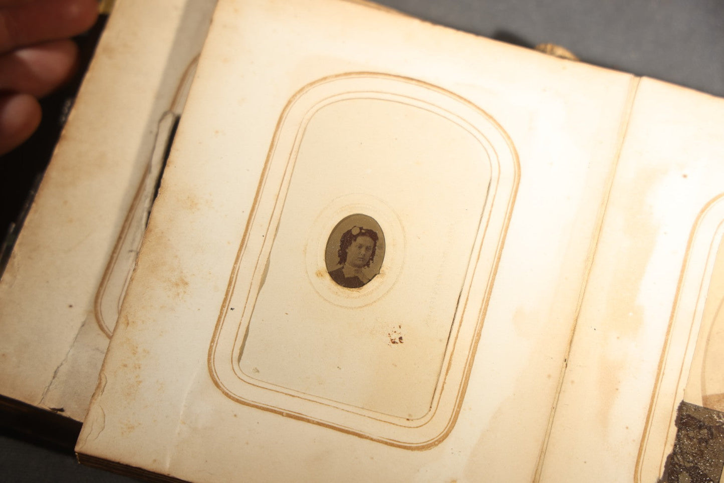 Antique Portrait Photo Album Containing 15 Tintype Photographs and 29 C.D.V. Photographs, Including Hand-Tinted Tintype Examples, note binding in poor condition