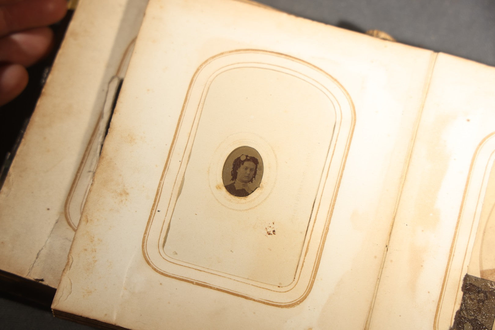 Antique Portrait Photo Album Containing 15 Tintype Photographs and 29 C.D.V. Photographs, Including Hand-Tinted Tintype Examples, note binding in poor condition