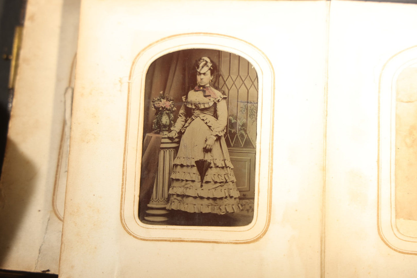 Antique Portrait Photo Album Containing 15 Tintype Photographs and 29 C.D.V. Photographs, Including Hand-Tinted Tintype Examples, note binding in poor condition