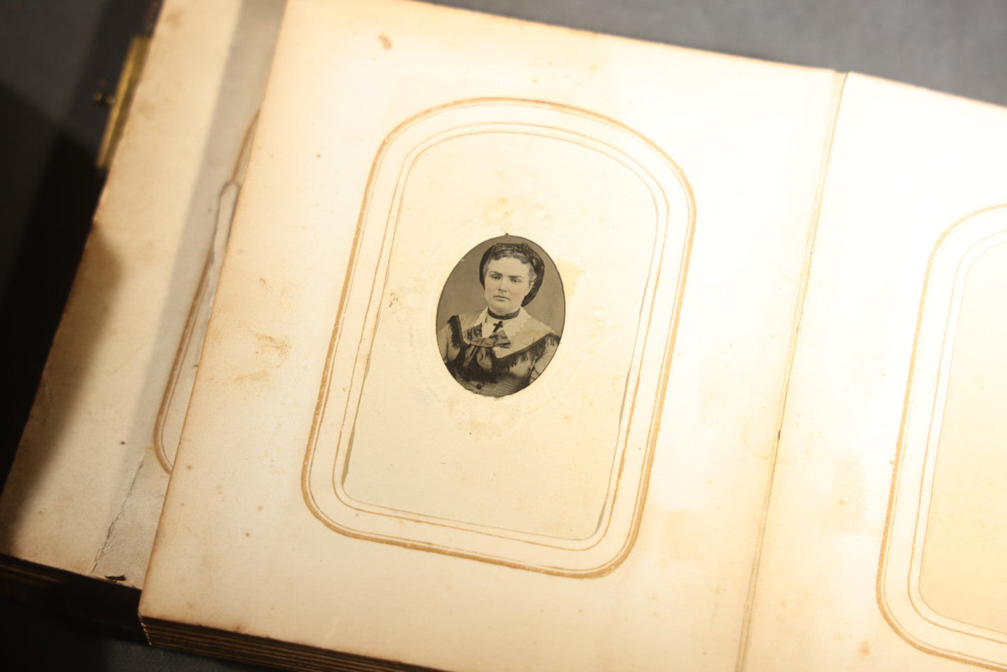 Antique Portrait Photo Album Containing 15 Tintype Photographs and 29 C.D.V. Photographs, Including Hand-Tinted Tintype Examples, note binding in poor condition