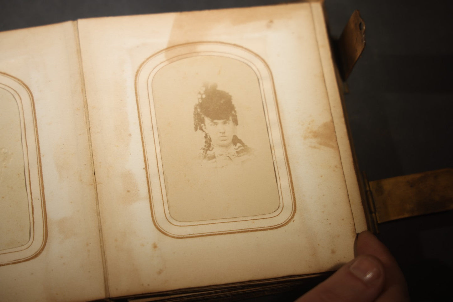Antique Portrait Photo Album Containing 15 Tintype Photographs and 29 C.D.V. Photographs, Including Hand-Tinted Tintype Examples, note binding in poor condition