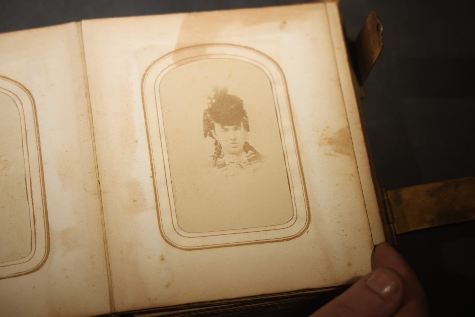 Antique Portrait Photo Album Containing 15 Tintype Photographs and 29 C.D.V. Photographs, Including Hand-Tinted Tintype Examples, note binding in poor condition