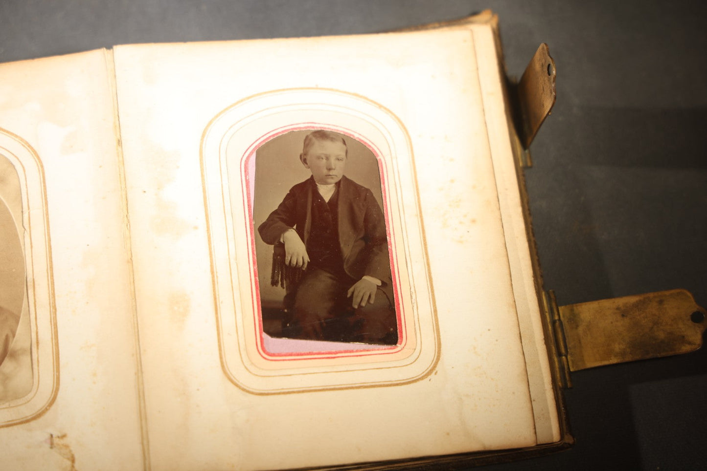 Antique Portrait Photo Album Containing 15 Tintype Photographs and 29 C.D.V. Photographs, Including Hand-Tinted Tintype Examples, note binding in poor condition