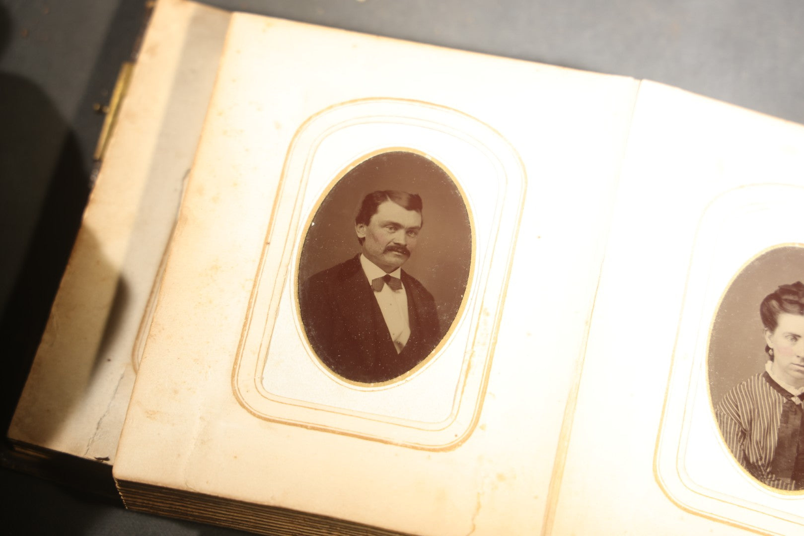 Antique Portrait Photo Album Containing 15 Tintype Photographs and 29 C.D.V. Photographs, Including Hand-Tinted Tintype Examples, note binding in poor condition