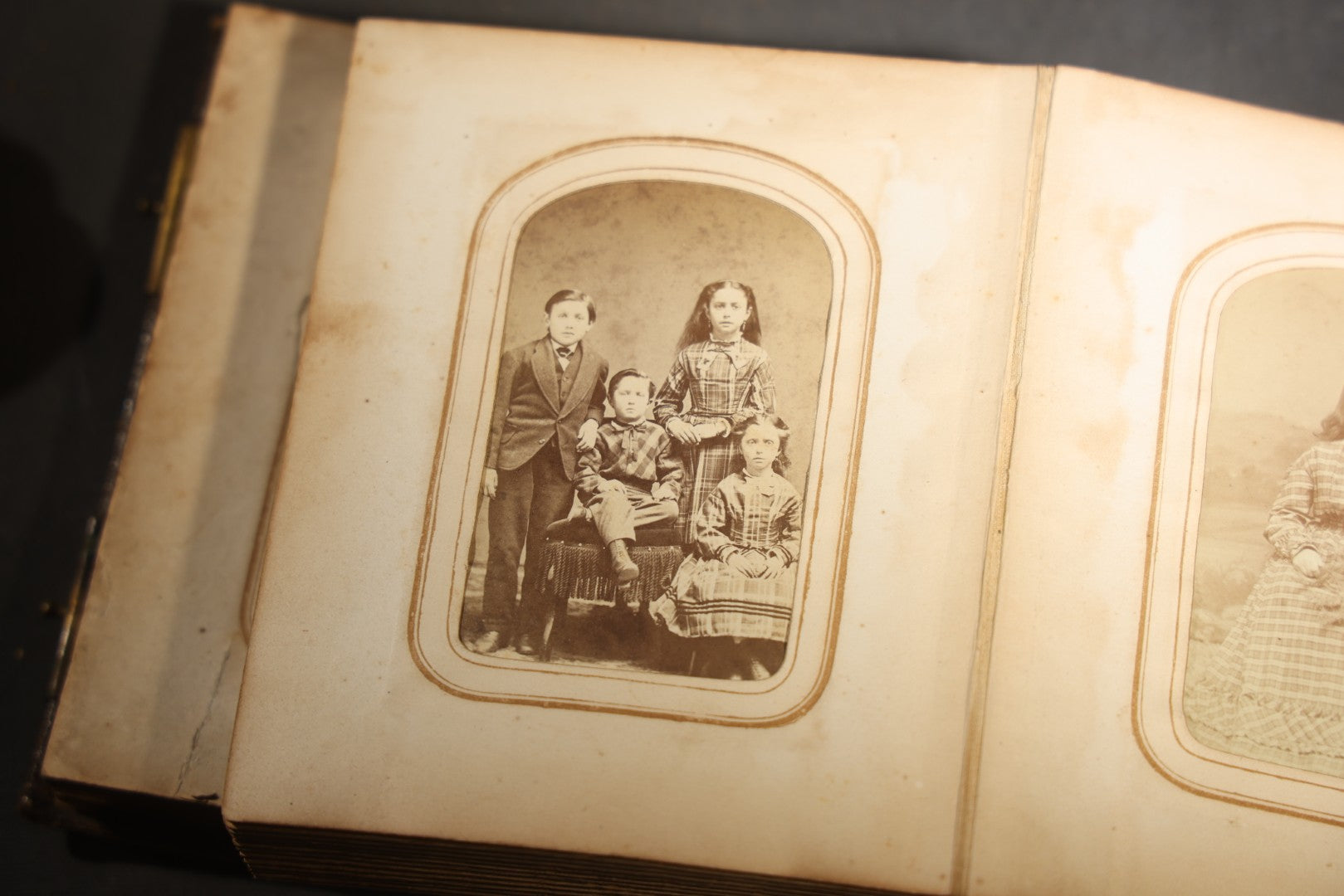 Antique Portrait Photo Album Containing 15 Tintype Photographs and 29 C.D.V. Photographs, Including Hand-Tinted Tintype Examples, note binding in poor condition