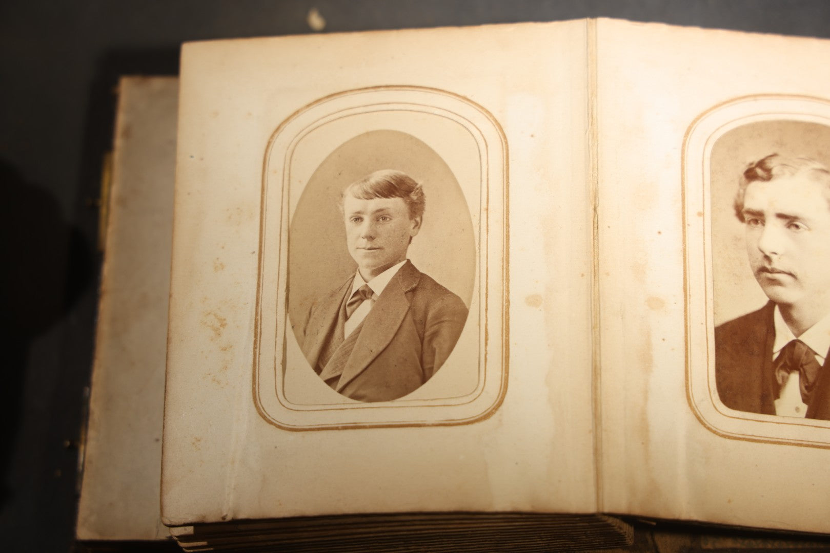 Antique Portrait Photo Album Containing 15 Tintype Photographs and 29 C.D.V. Photographs, Including Hand-Tinted Tintype Examples, note binding in poor condition
