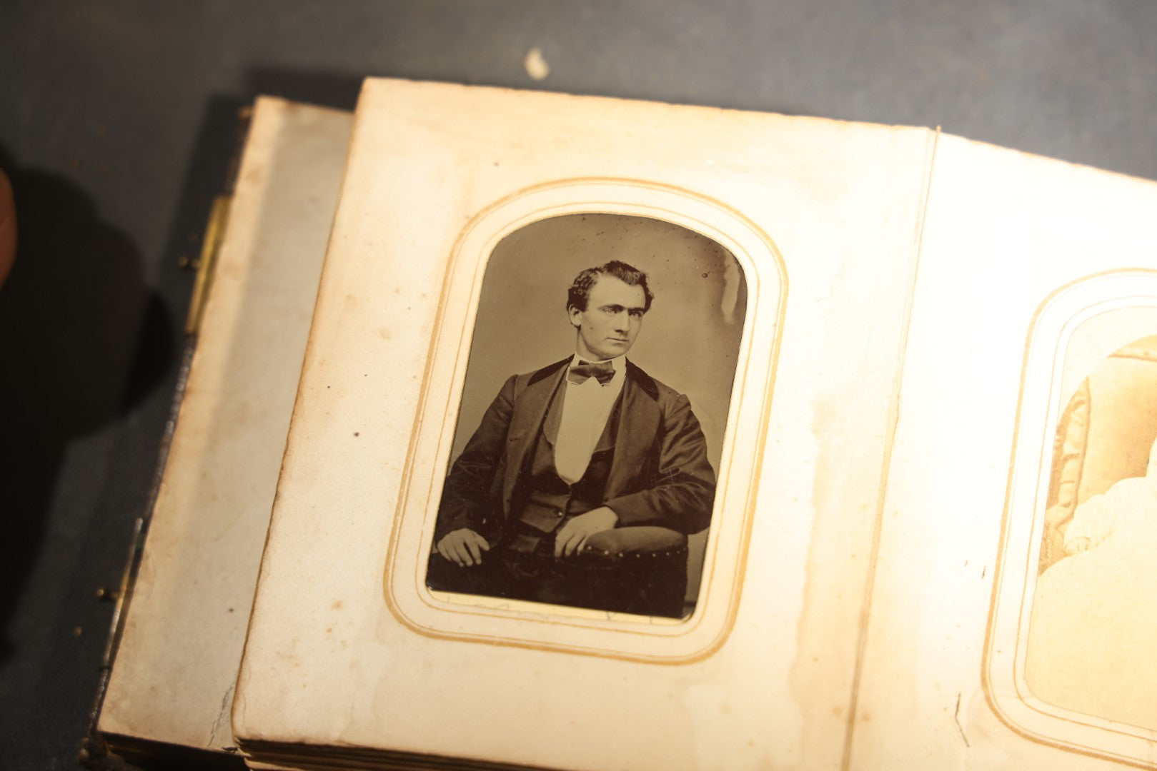 Antique Portrait Photo Album Containing 15 Tintype Photographs and 29 C.D.V. Photographs, Including Hand-Tinted Tintype Examples, note binding in poor condition