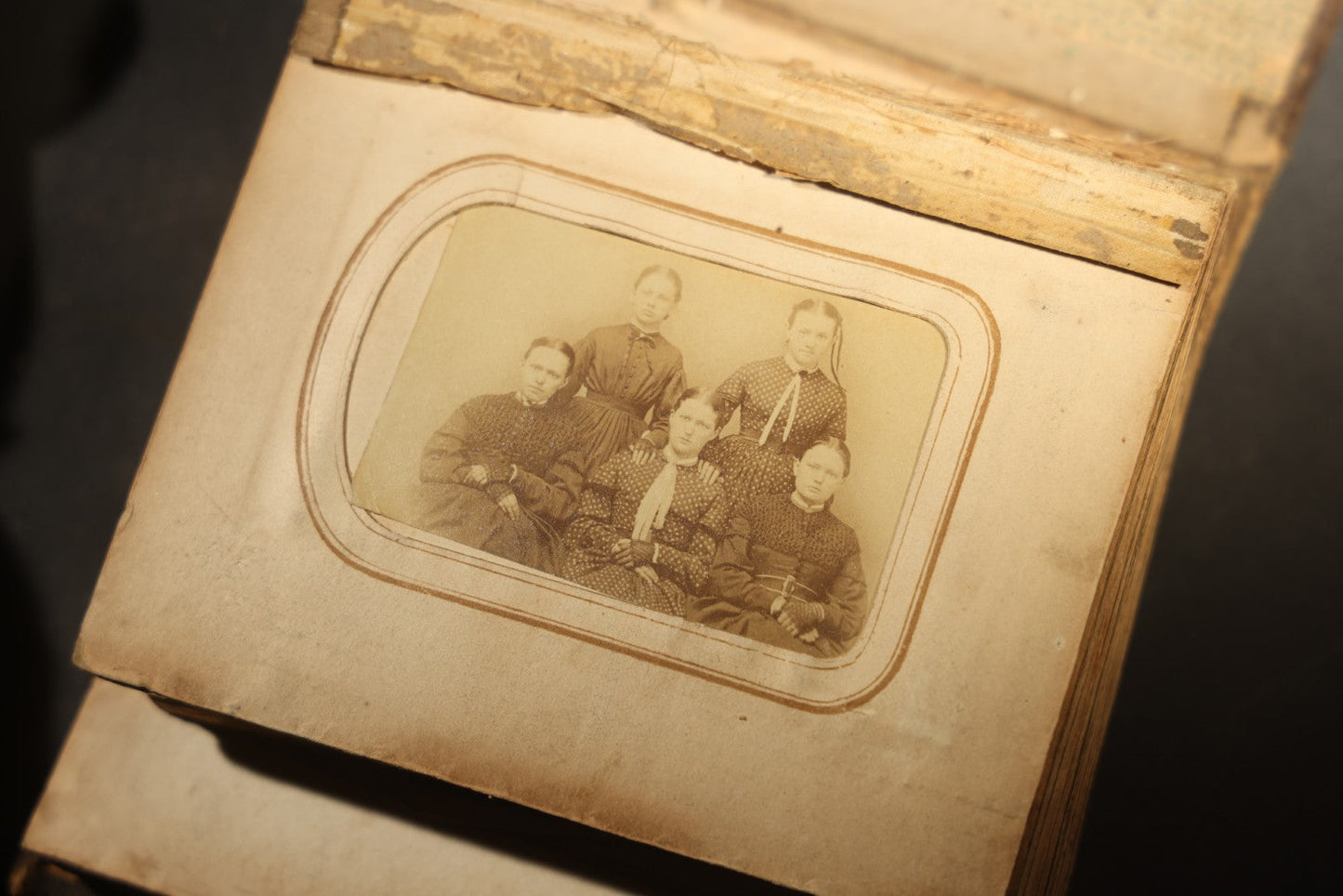 Antique Portrait Photo Album Containing 15 Tintype Photographs and 29 C.D.V. Photographs, Including Hand-Tinted Tintype Examples, note binding in poor condition
