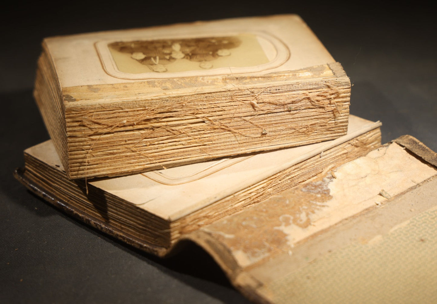 Antique Portrait Photo Album Containing 15 Tintype Photographs and 29 C.D.V. Photographs, Including Hand-Tinted Tintype Examples, note binding in poor condition