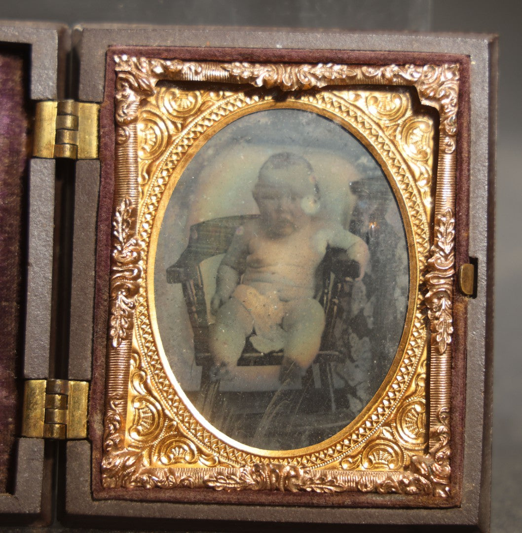 Antique 1/9th Plate Ambrotype Photograph of a Seated Baby in Thermoplastic Union Case with Floral Motif