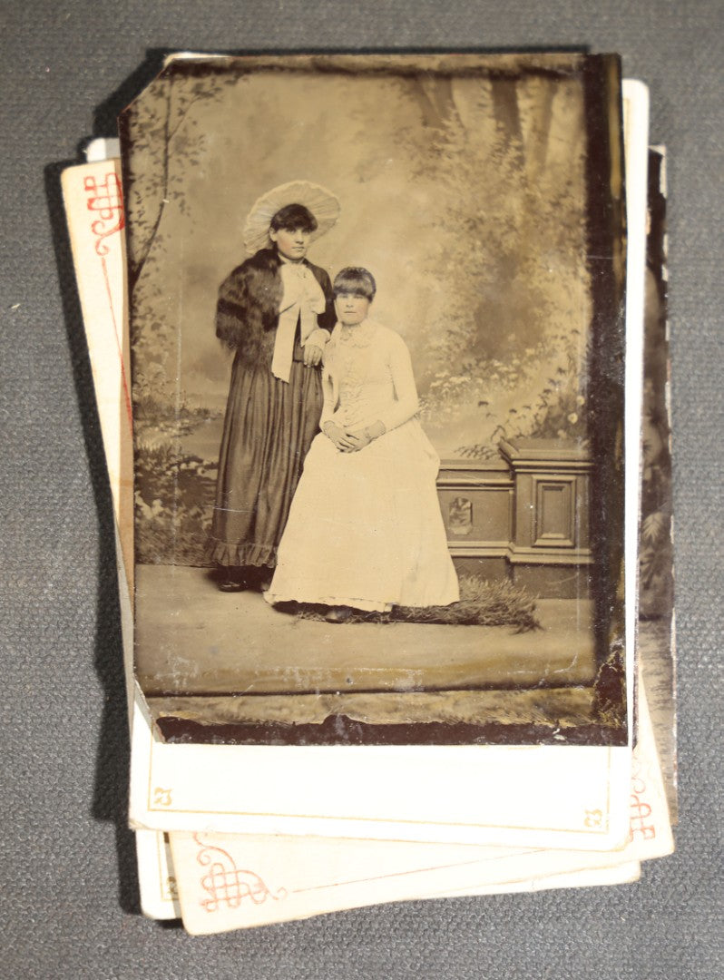 Grouping of Seven Antique Tintype Photographs of Women in Victorian Hats and Late 19th Century Dress