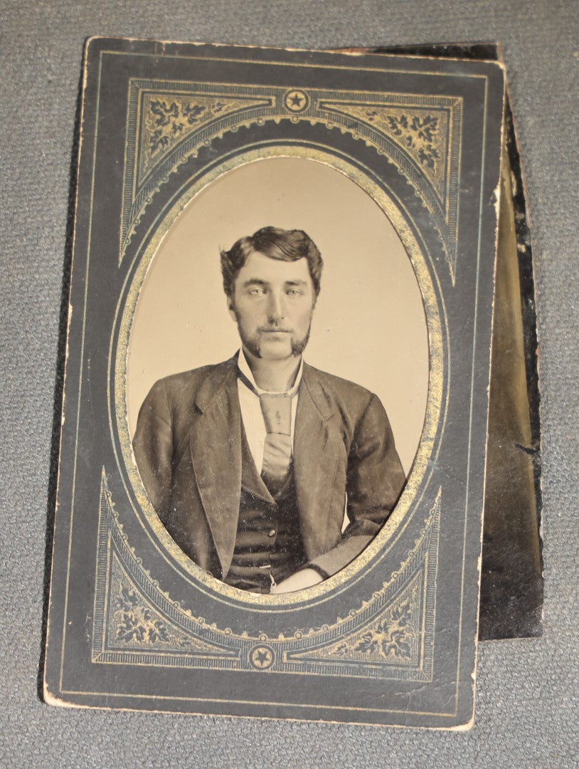 Grouping of 10 Antique Tintype Photographs of Men, Some in Paper Frames and Mats, Including Various Portrait Poses