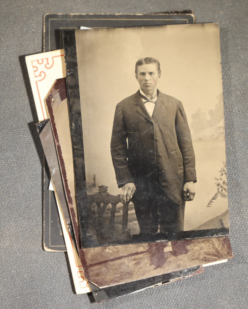 Grouping of 10 Antique Tintype Photographs of Men, Some in Paper Frames and Mats, Including Various Portrait Poses