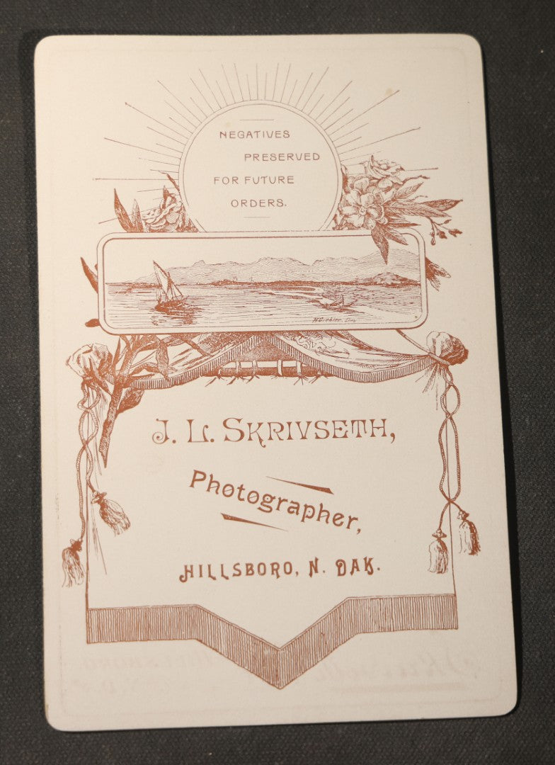 Grouping of Seven Antique Cabinet Card Photographs of Children Including Two Boys in Sailor Suits, with examples by J. L. Skrivseth, Hillsboro, North Dakota