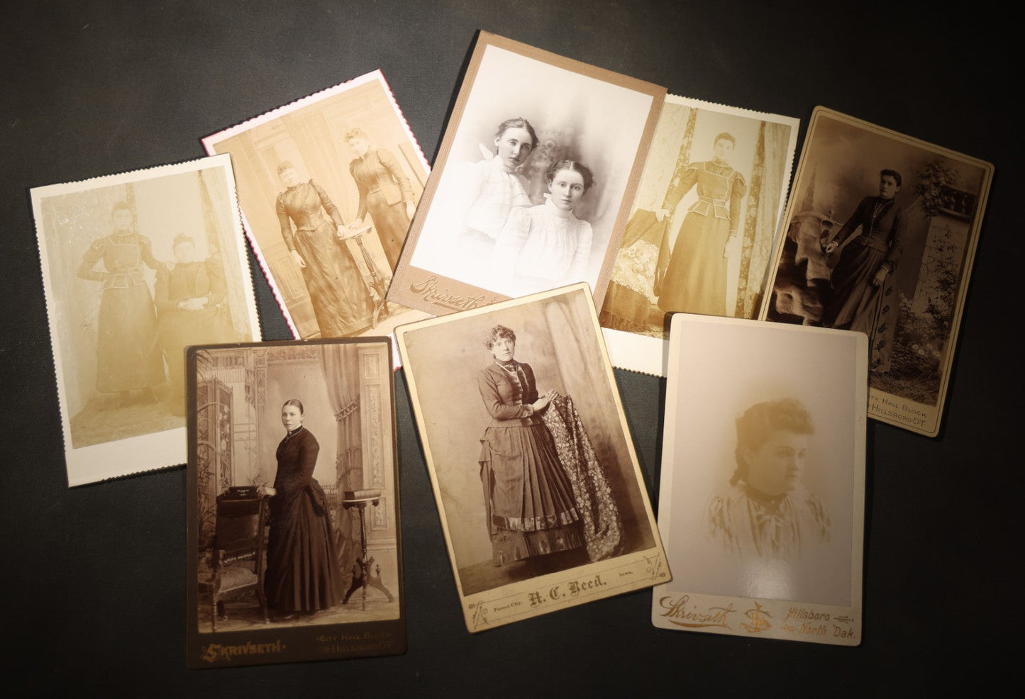 Grouping of Eight Antique Cabinet Card Photographs of Victorian Women Including examples by H.C. Reed, Forest City Iowa, Skrivseth, Hillsboro, North Dakota