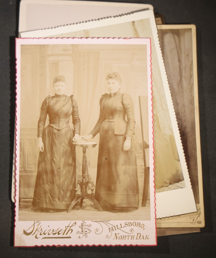 Grouping of Eight Antique Cabinet Card Photographs of Victorian Women Including examples by H.C. Reed, Forest City Iowa, Skrivseth, Hillsboro, North Dakota