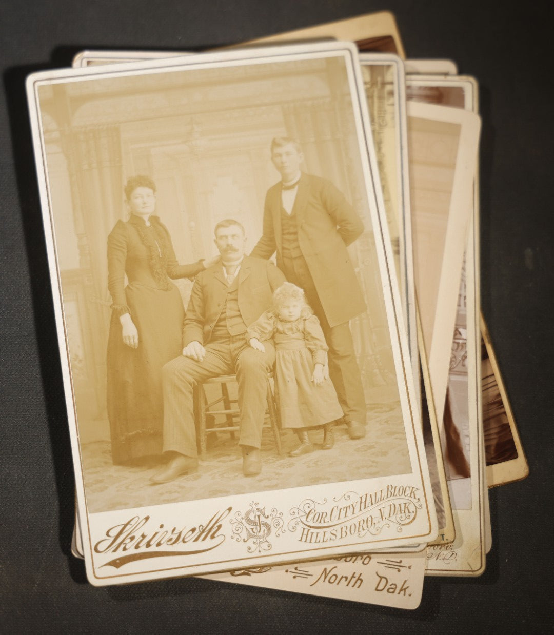Grouping of Eight Antique Cabinet Card Photographs of Victorian Couples and Family Groups Including by Skrivseth, Hillsboro, North Dakota