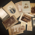Lot 104 - Grouping of 10 Antique and Vintage Photographs including a Boy with Wagon, a Railroad Car, C.D.V.s, cabinet cards, and Family Groups