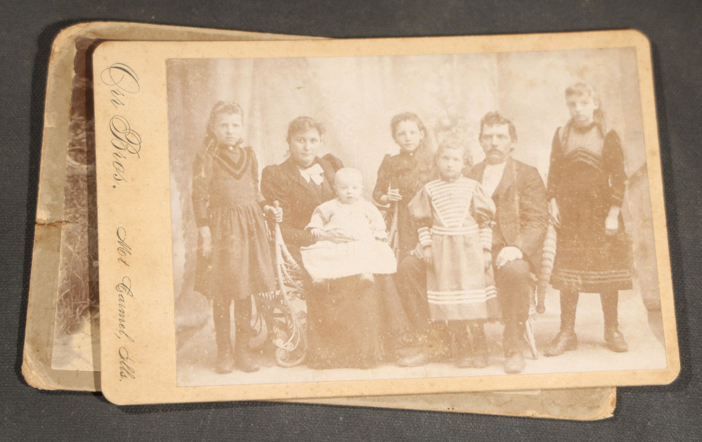 Grouping of 10 Antique and Vintage Photographs including a Boy with Wagon, a Railroad Car, C.D.V.s, cabinet cards, and Family Groups
